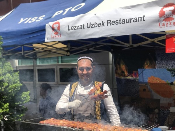 Abdullaev Makhmud posing with his signature cuisine.