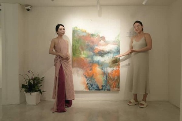 Photo taken with the artist in front of the artwork