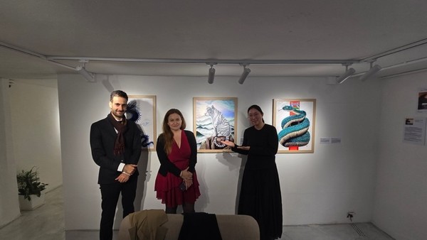 Photo with the Cultural Attaché of the French Embassy on the far left and the artist