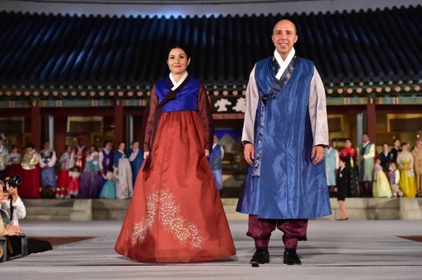 H.E. Dr. Chafik Rachadi, Ambassador of His Majesty the King of Morocco to the Republic of Korea, accompanied by his spouse, Mrs. Leila Chelly, elegantly dressed in a traditional Hanbok during the fashion show